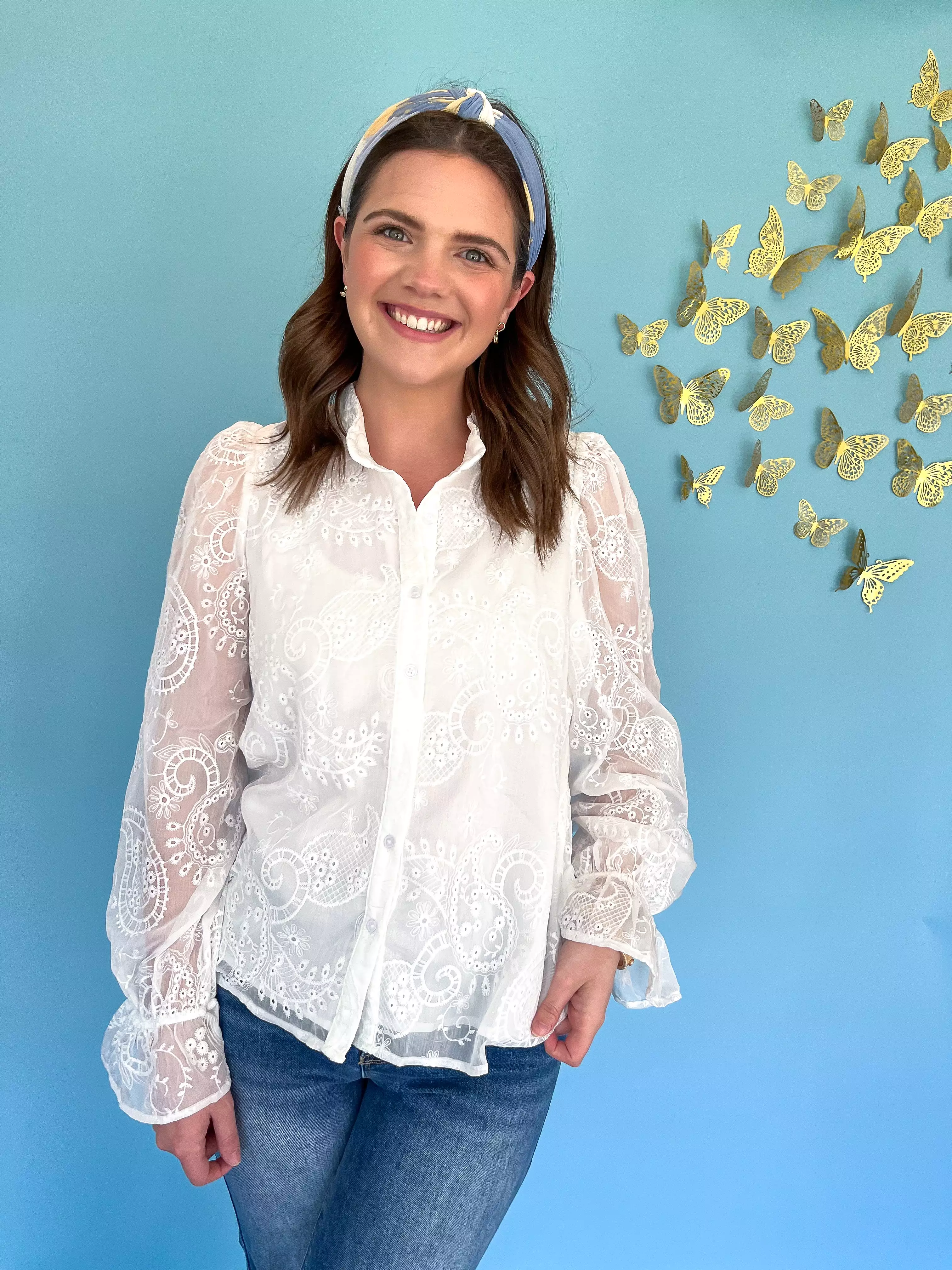 White embroidered floral blouse.