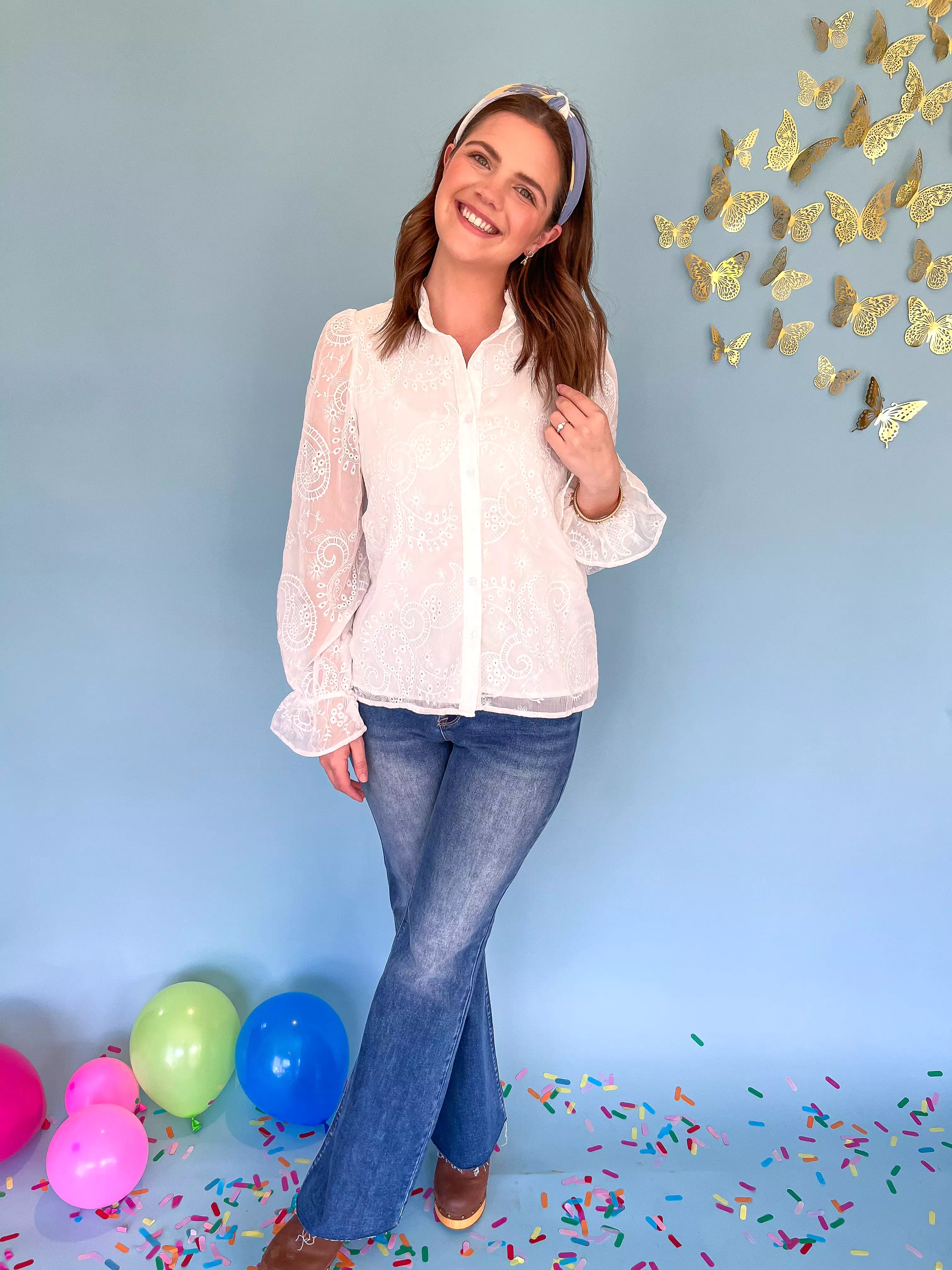 White embroidered floral blouse.