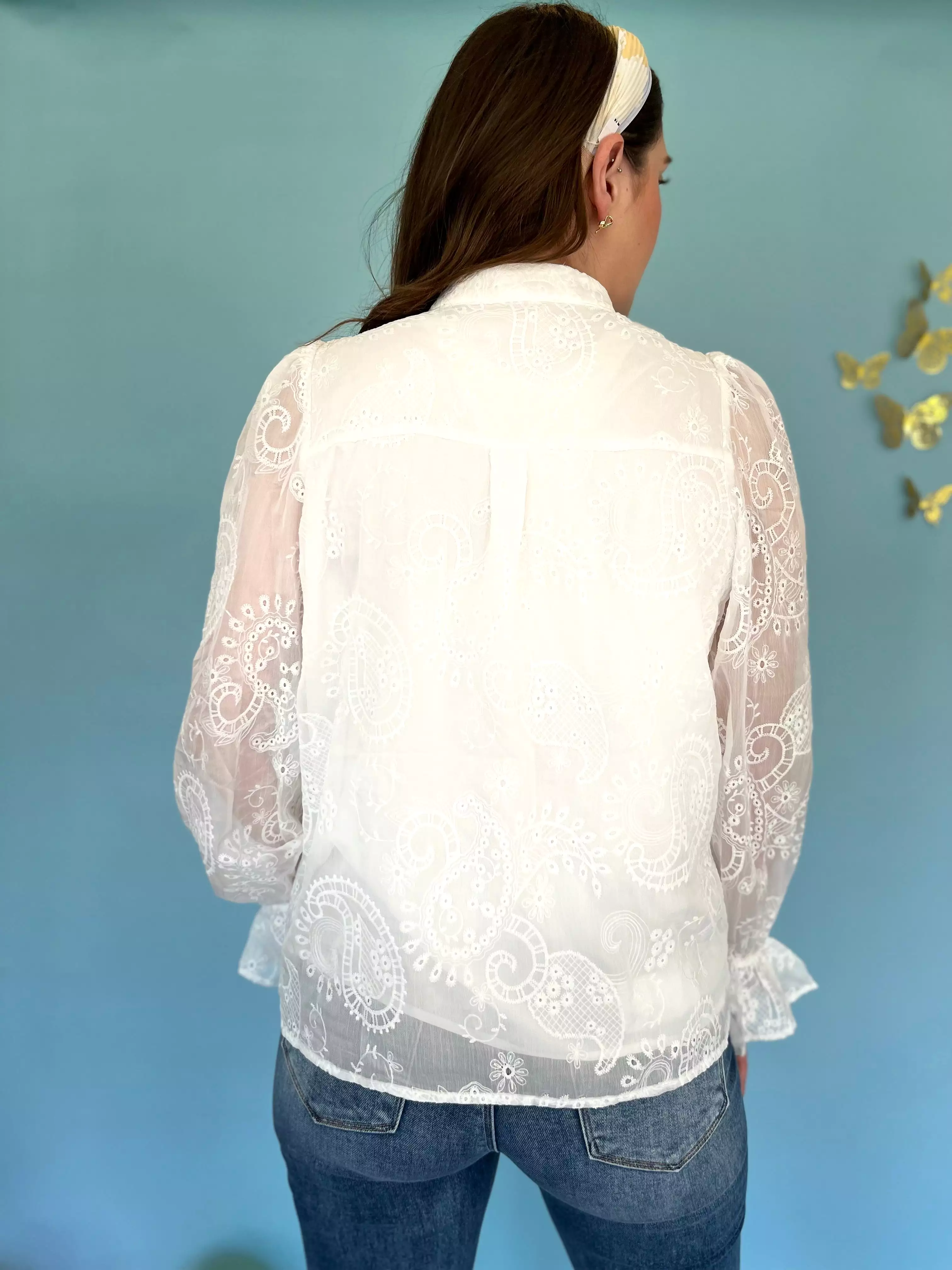 White embroidered floral blouse.